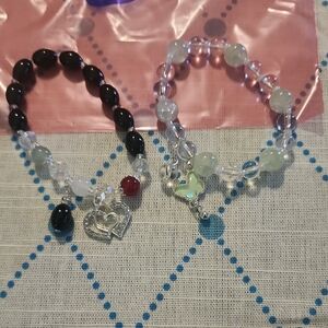 Black and Clear Beaded Bracelets with Charms